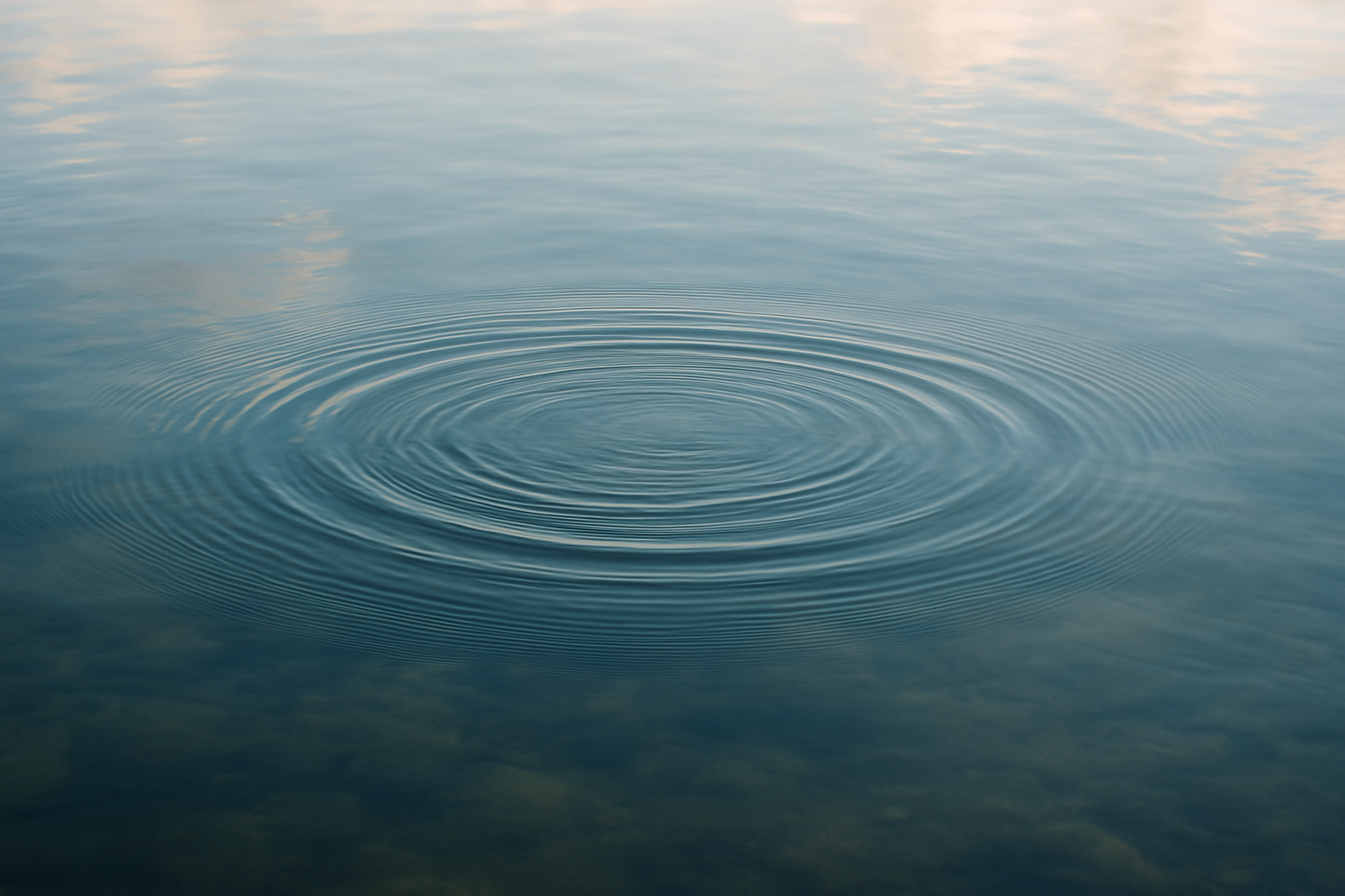 Gentle ripples on calm water, echoing natural harmony and wellness on Manitoulin.